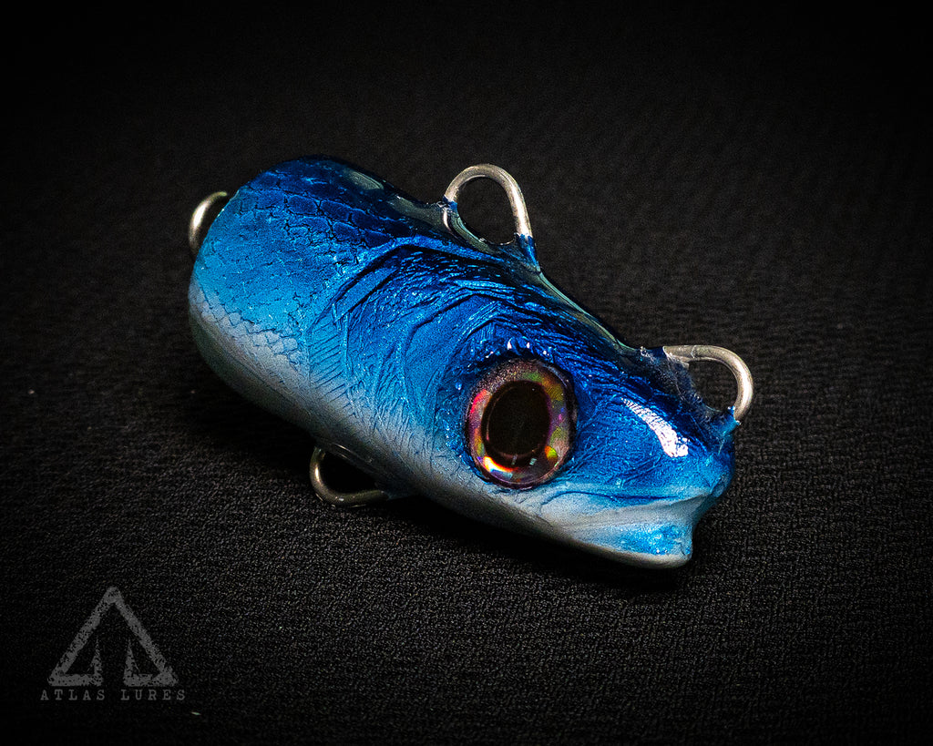 Blue fishing lure on a black background