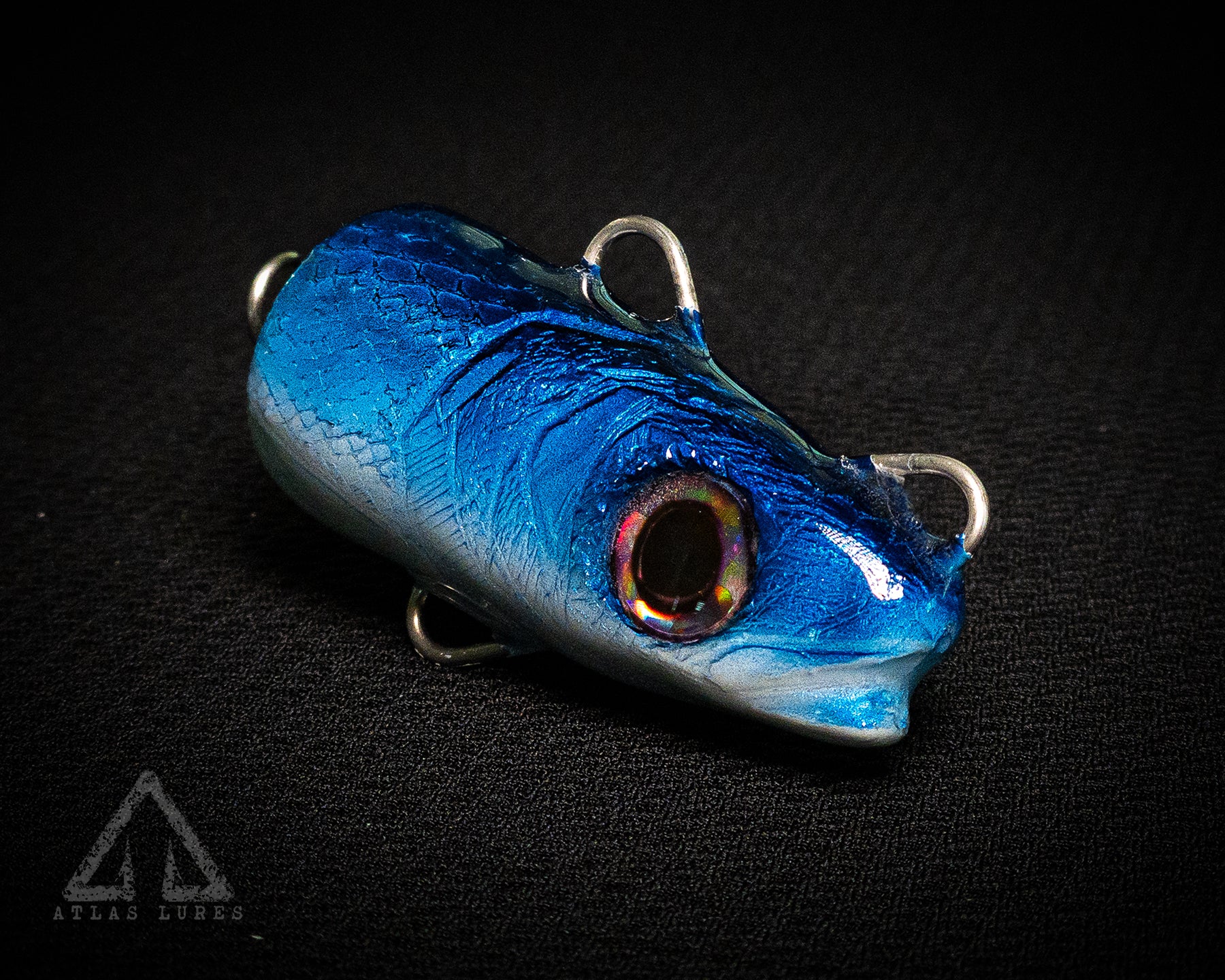 Blue fishing lure on a black background