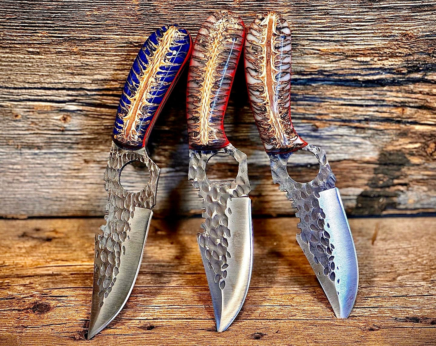 Three ornate knives with decorative stabilized pinecone handles