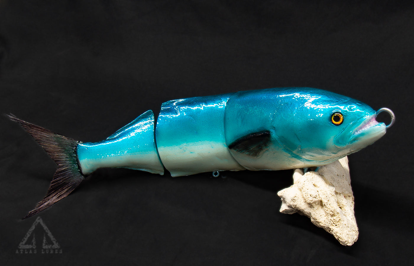 Blue fishing lure on a dark background