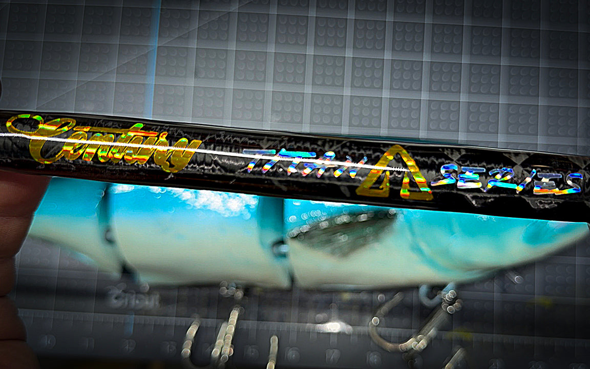 Close-up of a product with 'Century" branding on a reflective surface.