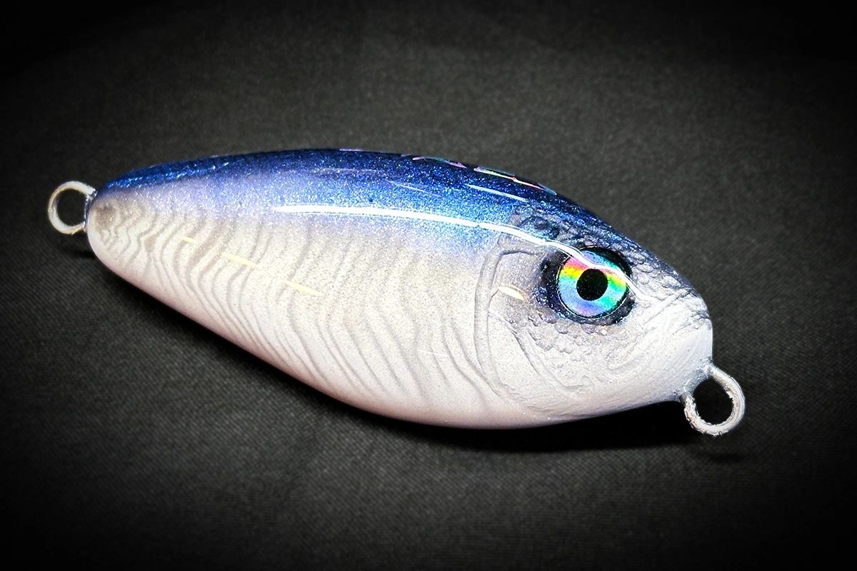Fishing lure with a detailed design on a black background