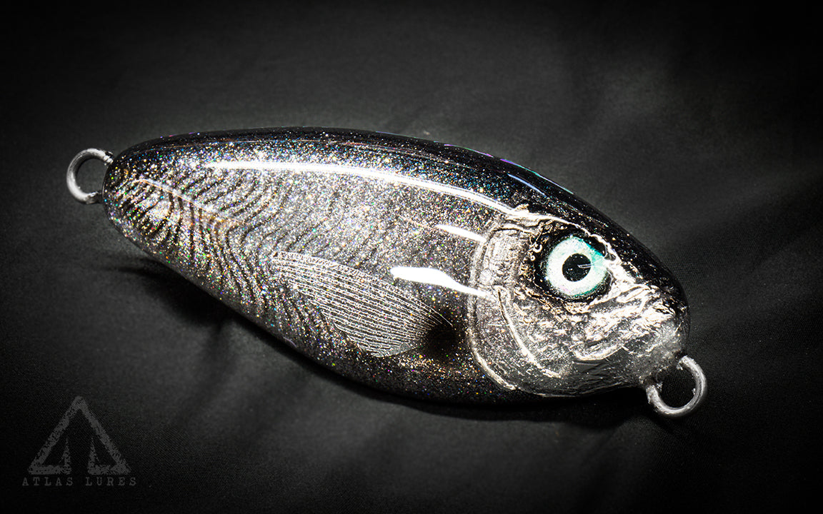 Metallic fishing lure on a dark background. Handmade in USA