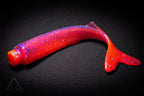 Red fishing lure with a black background