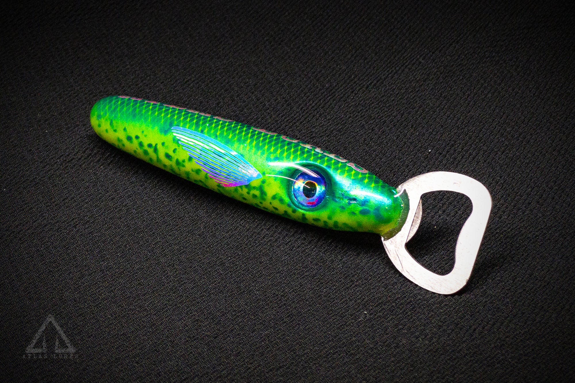 Green fishing lure with a bottle opener on a black background