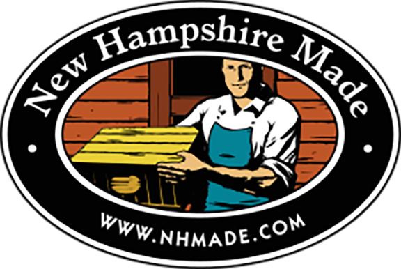 Logo for 'New Hampshire Made' with a person holding a wooden crate.