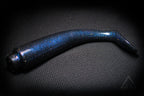Blue glittery fishing lure on a dark textured background