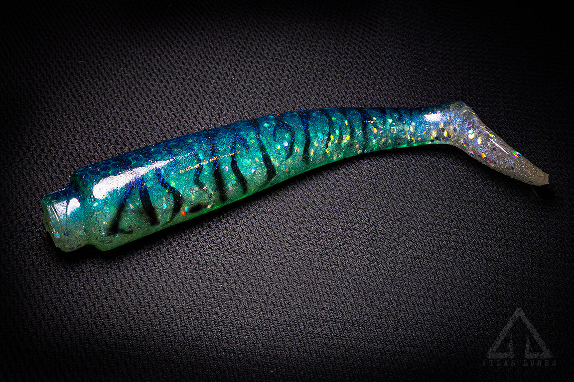 Blue and green fishing lure on a black background