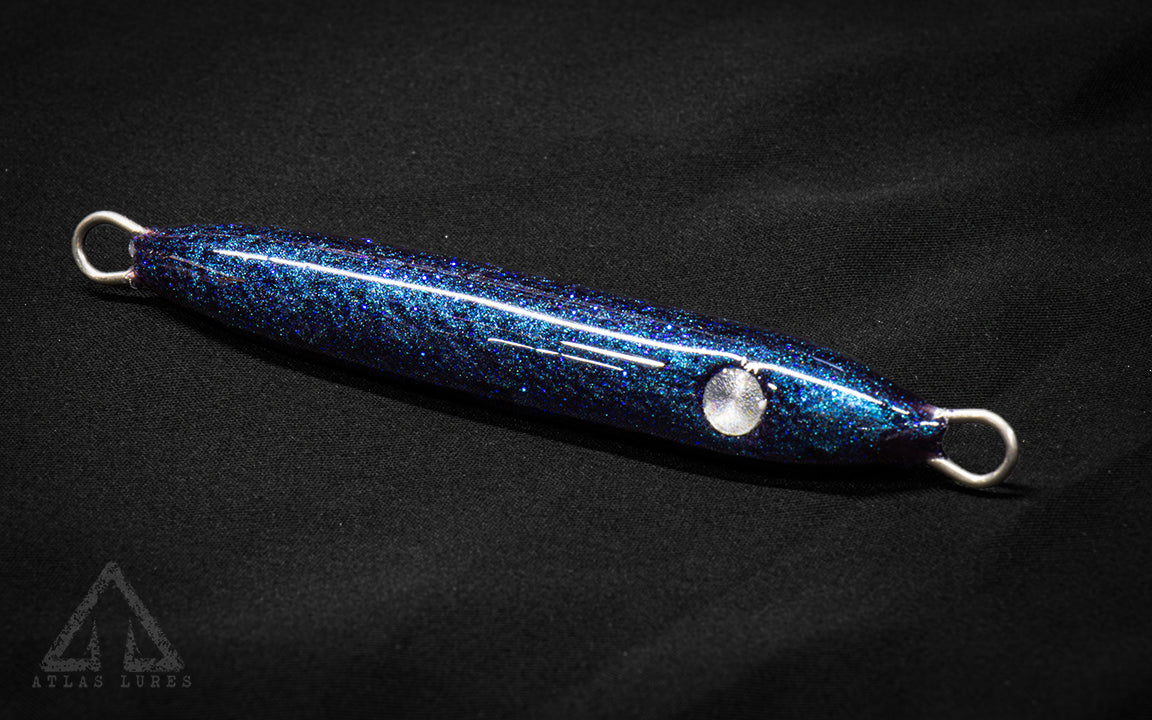 Blue glittery fishing lure on a black background