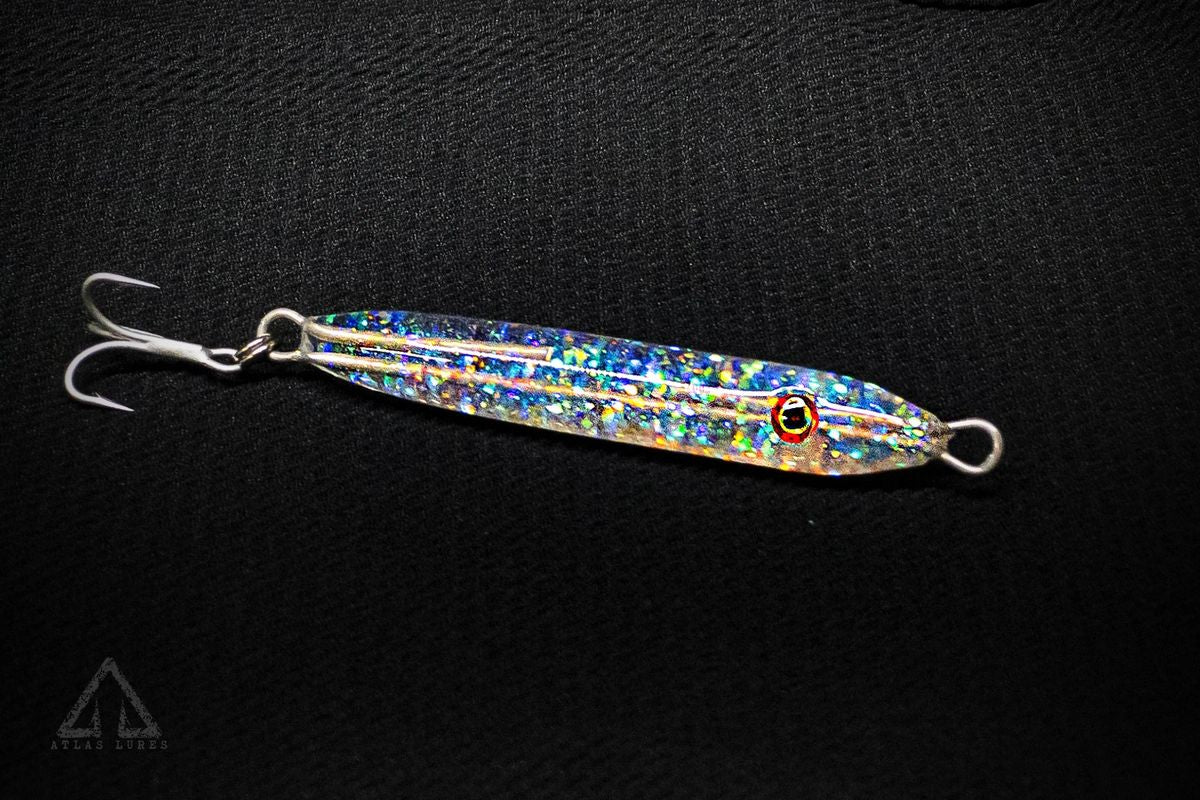Clear Fishing lure with a glitter finish on a black background