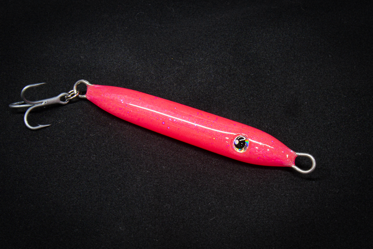 Pink fishing lure with a black background handmade in usa