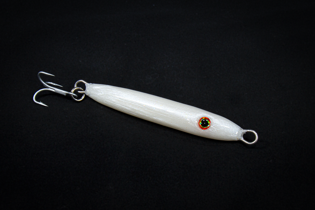 White fishing lure with a hook on a black background. Handmade in USA