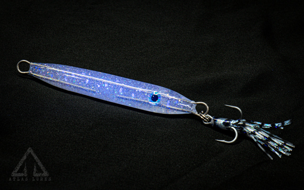 Fishing lure with blue glitter on a black background. made in usa