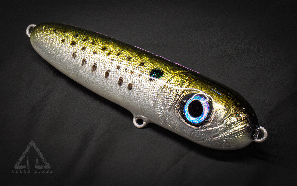 Fishing lure with a detailed design on a dark background
