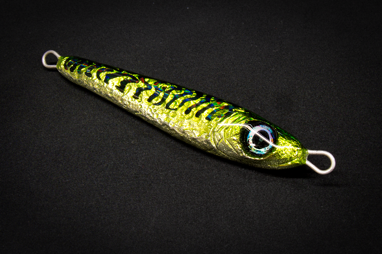 Fishing lure with a metallic finish on a black background
