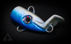 Blue and white fishing lure on a black background