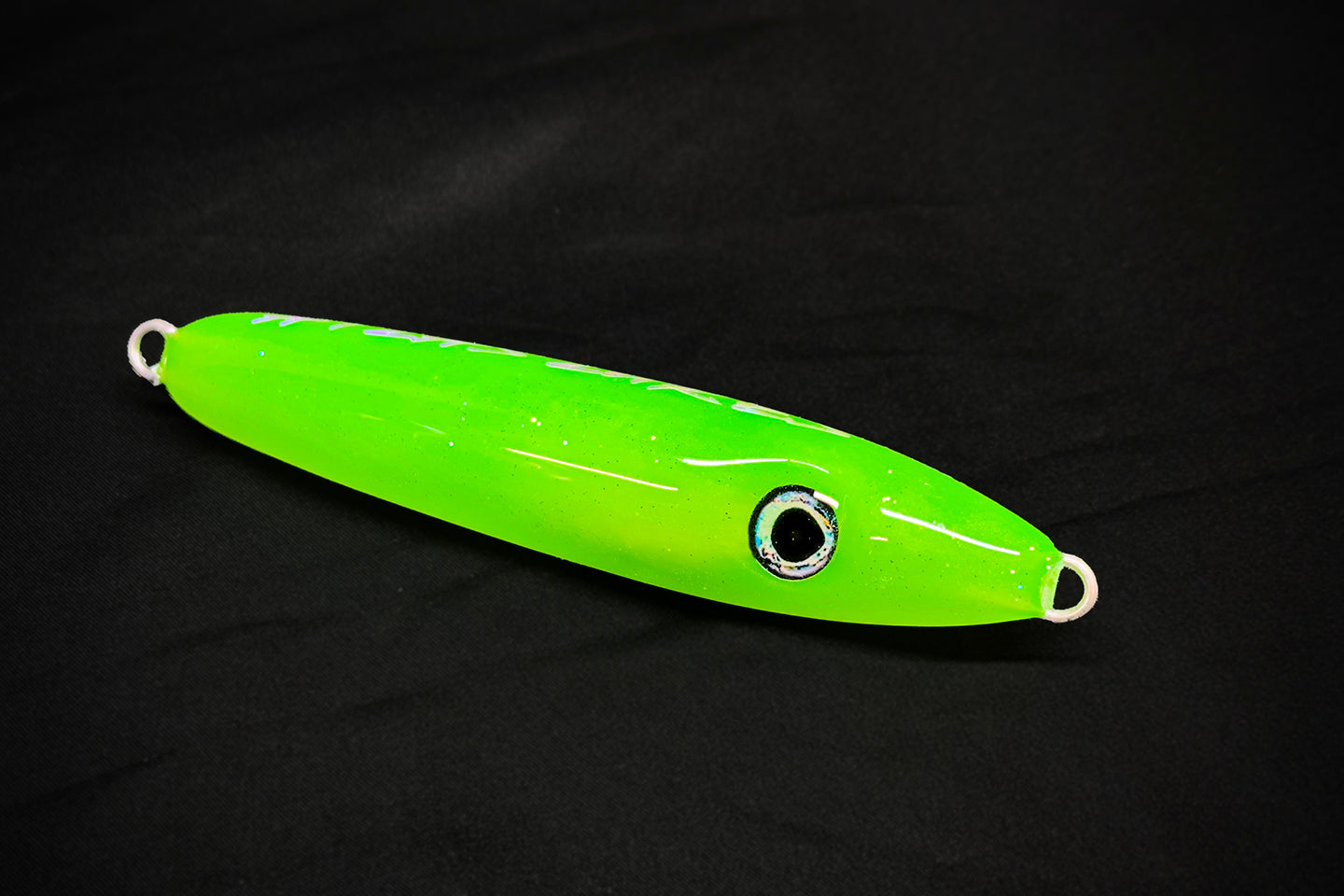 Green fishing lure on a black background made in USA