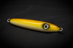 Hand poured resin Yellow fishing lure on a black background