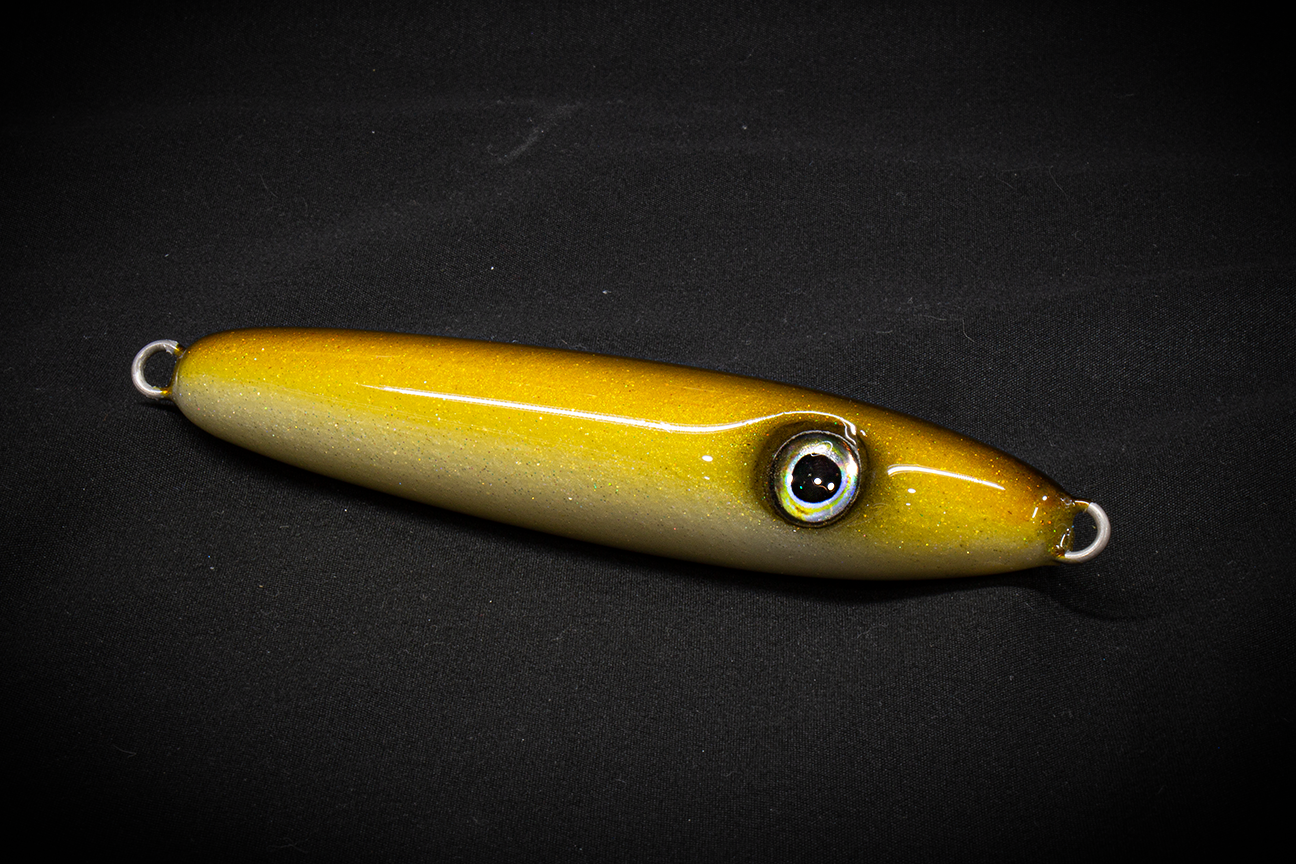 Hand poured resin Yellow fishing lure on a black background